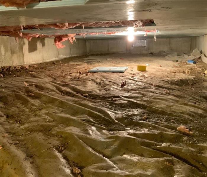 Crawlspace affected by water damage.